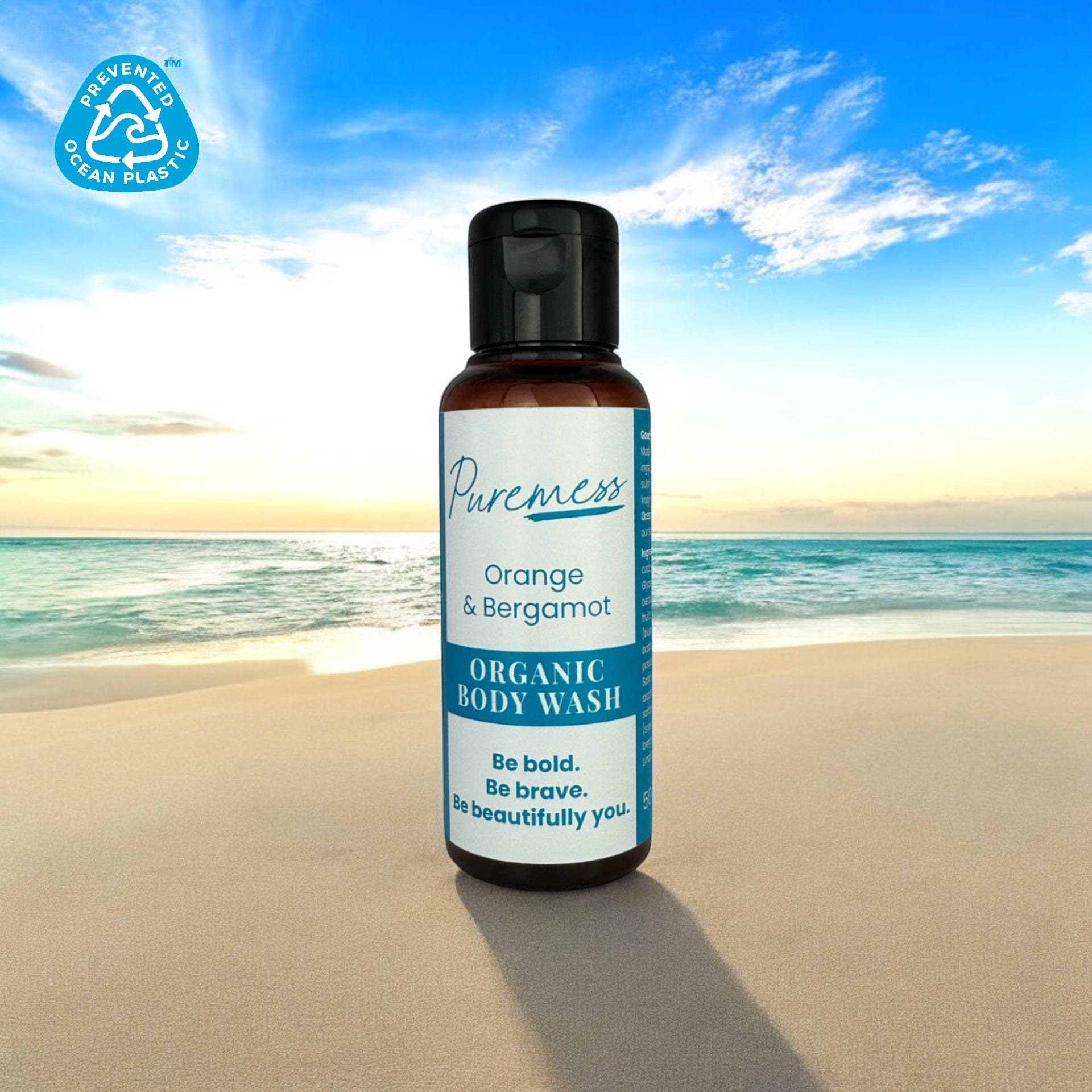 Amber container with black cap holding Puremess Orange & Bergamot organic body wash, eco-friendly beauty with botanical. - Orange & Bergamot Body Wash - PUREMESS SKINCARE
