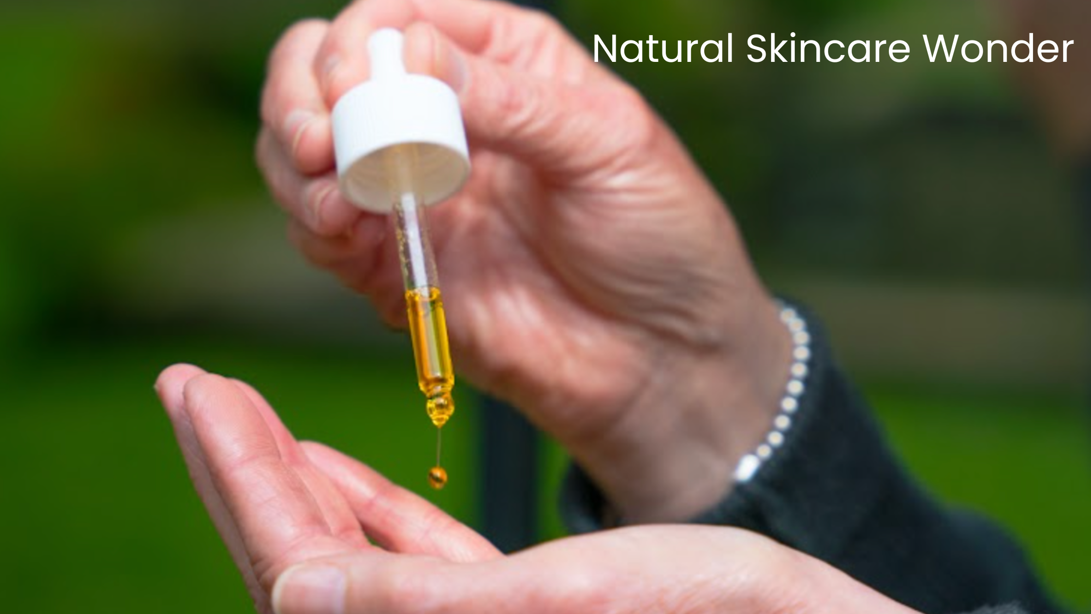 facial oil being dropped out of a pipette onto a palm