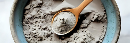 dead sea face mask powder in a bowl with a spoon
