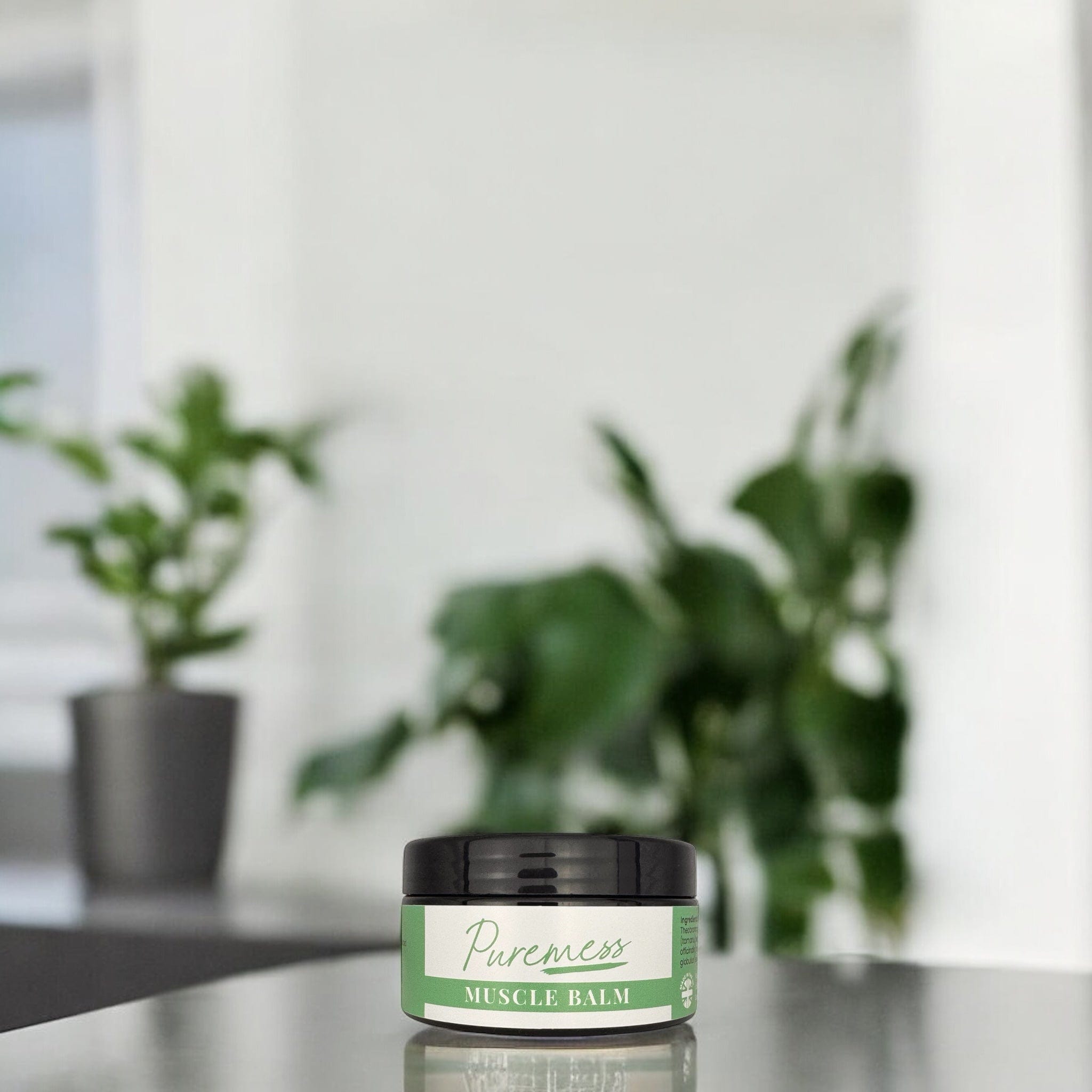 Muscle Balm with green label, black lid, natural skincare and botanical ingredients, sustainable packaging from Puremess,. - Muscle Balm - PUREMESS SKINCARE