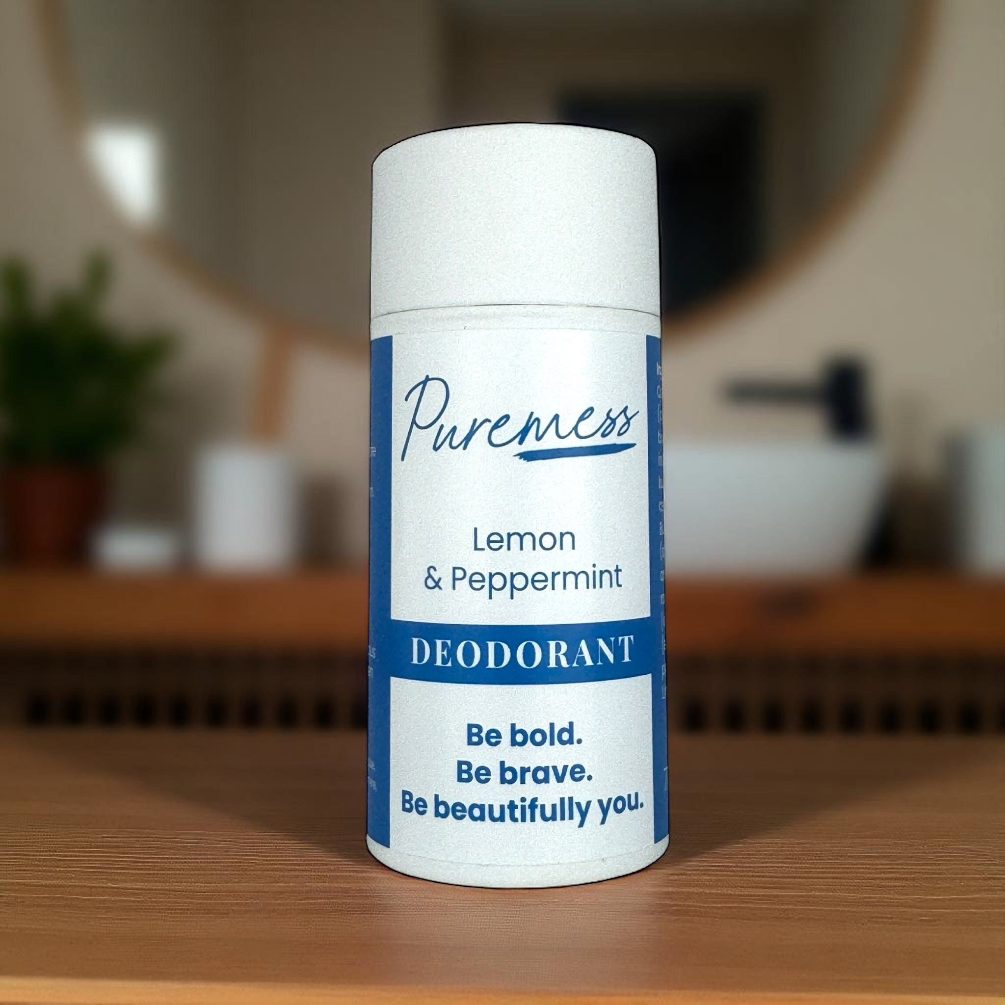 White stick deodorant with blue label reading "Puremess Lemon & Peppermint Deodorant" featuring messages promoting boldness, . - Lemon & Peppermint Vegan Deodorant - PUREMESS SKINCARE