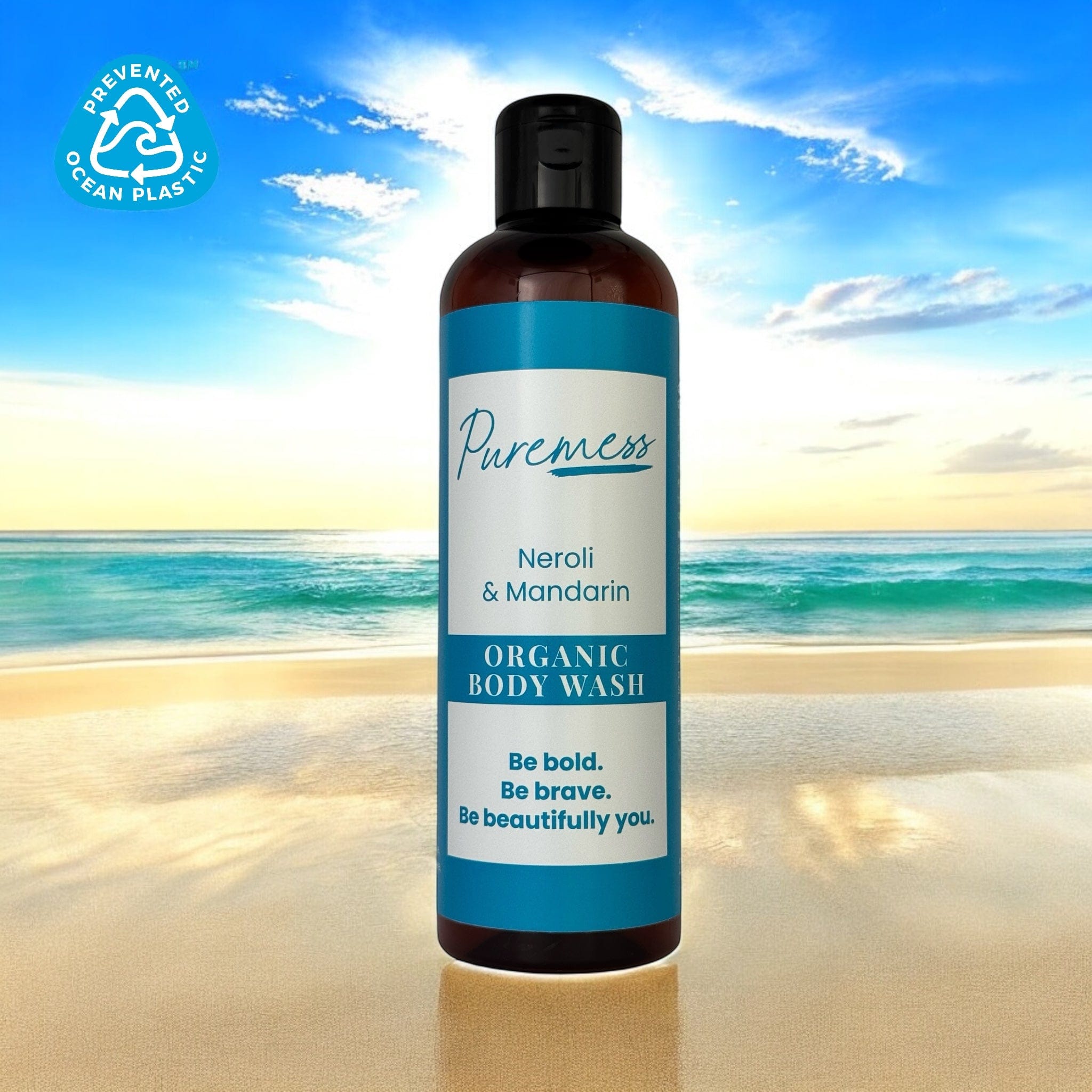 Dark amber container with blue and white label for Puremess Neroli & Mandarin organic body wash, highlighting natural. - Neroli & Mandarin Organic Body Wash - PUREMESS SKINCARE